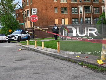 Shell casings are being seen next to evidence markers at the crime scene. Two people are being shot in Chicago, Illinois, United States, on...