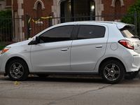 A vehicle window is being damaged with a bullet hole at the crime scene. Two people are being shot in Chicago, Illinois, United States, on M...