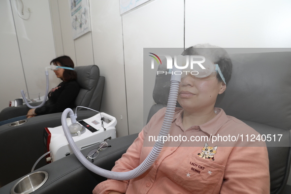 Patients are having their eyes fumigated with traditional Chinese medicine at the ophthalmology department of Shaoxing Central Hospital in S...