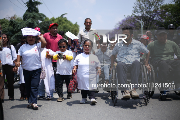 Nepali wheelchair users are rallying on the roads of Kathmandu, Nepal, on May 15, 2024, demanding the government address their demand for eq...