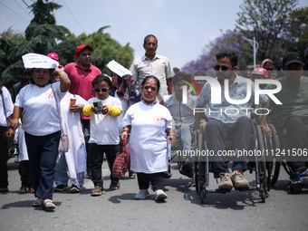 Nepali wheelchair users are rallying on the roads of Kathmandu, Nepal, on May 15, 2024, demanding the government address their demand for eq...