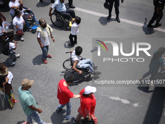 Nepali wheelchair users are rallying on the roads of Kathmandu, Nepal, on May 15, 2024, demanding the government address their demand for eq...