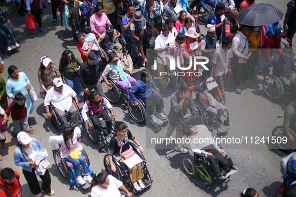 Nepali wheelchair users are rallying on the roads of Kathmandu, Nepal, on May 15, 2024, demanding the government address their demand for eq...