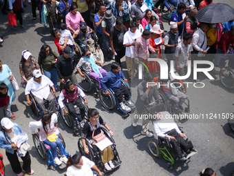 Nepali wheelchair users are rallying on the roads of Kathmandu, Nepal, on May 15, 2024, demanding the government address their demand for eq...