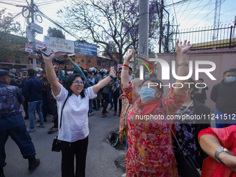 Supporters and fans of Sandeep Lamichhane are reacting and celebrating outside the Patan High Court after hearing the news of acquittal from...