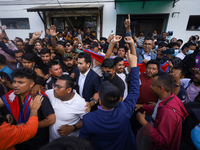 Supporters and fans of Sandeep Lamichhane are reacting and celebrating outside the Patan High Court after hearing the news of acquittal from...