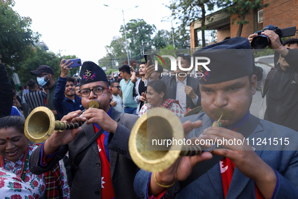 Supporters and fans of Sandeep Lamichhane are reacting and celebrating outside the Patan High Court after hearing the news of acquittal from...