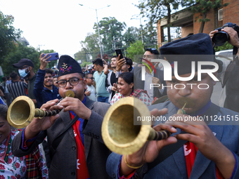 Supporters and fans of Sandeep Lamichhane are reacting and celebrating outside the Patan High Court after hearing the news of acquittal from...