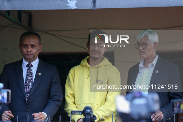 Sandeep Lamichhane (center), Nepal's leg-spinner cricketer, is attending a briefing alongside his legal team after being acquitted in a rape...