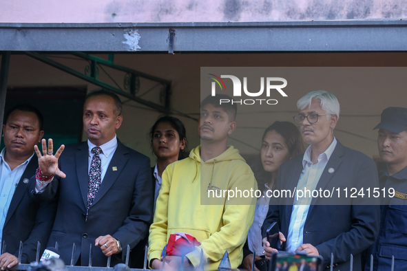 Sandeep Lamichhane (center), Nepal's leg-spinner cricketer, is attending a briefing alongside his legal team after being acquitted in a rape...