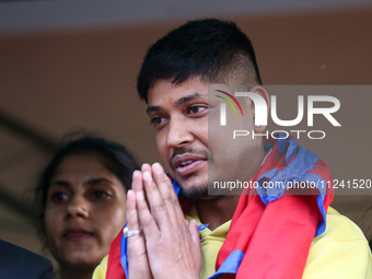 Sandeep Lamichhane, Nepal's leg-spinner cricketer, is greeting media and supporters after being acquitted in a rape case from the Patan High...