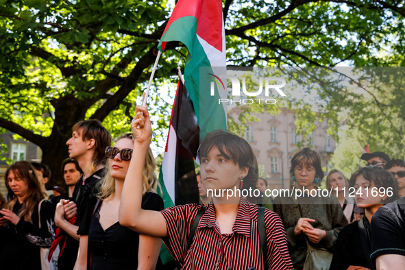 Students of Jagiellonia University hold Palestinian flags during academia demonstration against Israeli actions being taken in the Gaza Stri...