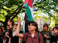 Students of Jagiellonia University hold Palestinian flags during academia demonstration against Israeli actions being taken in the Gaza Stri...