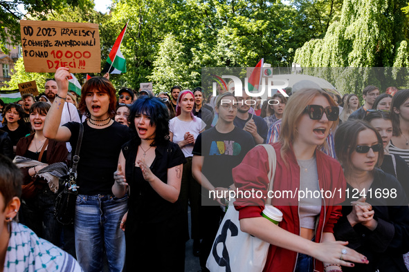 Students of Jagiellonia University  chant pro-Palestine slogans and hold Palestinian flags and banners during academia demonstration against...