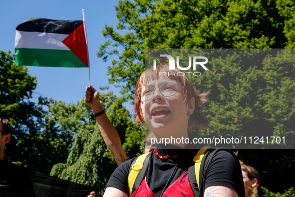 Students of Jagiellonia University  chant pro-Palestine slogans and hold Palestinian flags and banners during academia demonstration against...