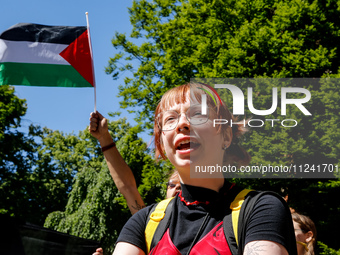 Students of Jagiellonia University  chant pro-Palestine slogans and hold Palestinian flags and banners during academia demonstration against...