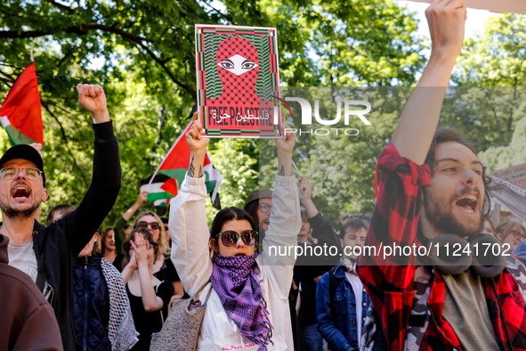 Students of Jagiellonia University  chant pro-Palestine slogans and hold Palestinian flags and banners during academia demonstration against...