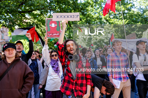 Students of Jagiellonia University  chant pro-Palestine slogans and hold Palestinian flags and banners during academia demonstration against...