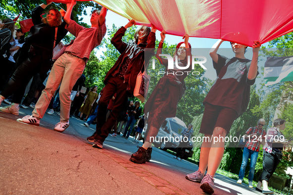 Students of Jagiellonia University  chant pro-Palestine slogans and hold Palestinian flags during academia demonstration against Israeli act...