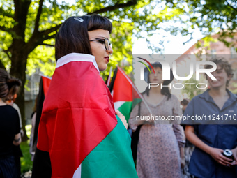 Students of Jagiellonia University  chant pro-Palestine slogans and hold Palestinian flags during academia demonstration against Israeli act...