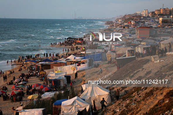 Tents and shacks are housing displaced Palestinians crowding the Mediterranean seashore in Deir el-Balah in the central Gaza Strip on May 15...