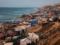 Tents and shacks are housing displaced Palestinians crowding the Mediterranean seashore in Deir el-Balah in the central Gaza Strip on May 15...