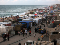 Tents and shacks are housing displaced Palestinians crowding the Mediterranean seashore in Deir el-Balah in the central Gaza Strip on May 15...