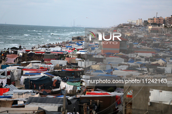 Tents and shacks are housing displaced Palestinians crowding the Mediterranean seashore in Deir el-Balah in the central Gaza Strip on May 15...