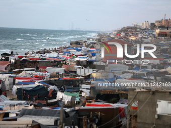 Tents and shacks are housing displaced Palestinians crowding the Mediterranean seashore in Deir el-Balah in the central Gaza Strip on May 15...