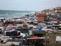 Tents and shacks are housing displaced Palestinians crowding the Mediterranean seashore in Deir el-Balah in the central Gaza Strip on May 15...