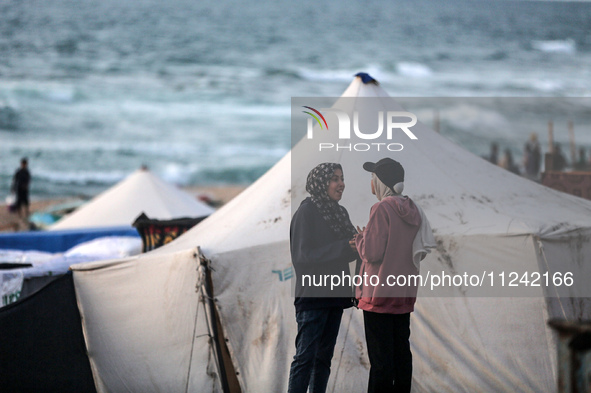 Tents and shacks are housing displaced Palestinians crowding the Mediterranean seashore in Deir el-Balah in the central Gaza Strip on May 15...