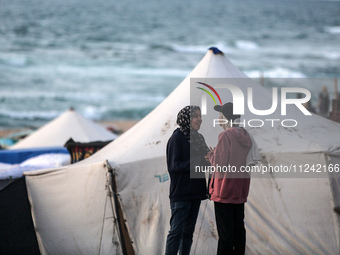 Tents and shacks are housing displaced Palestinians crowding the Mediterranean seashore in Deir el-Balah in the central Gaza Strip on May 15...