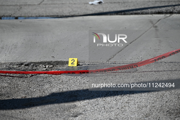 Evidence markers are highlighting where shell casings are being discovered. Two people are in critical condition after being shot in Chicago...