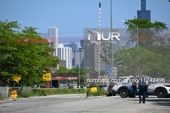 The road is being closed to the highway as Chicago police are investigating the shooting. Evidence markers are being placed on the ground to...