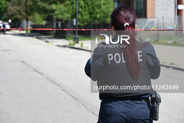 Chicago police are investigating the shooting scene. Two people are in critical condition after being shot in Chicago, Illinois, United Stat...