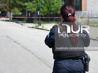 Chicago police are investigating the shooting scene. Two people are in critical condition after being shot in Chicago, Illinois, United Stat...