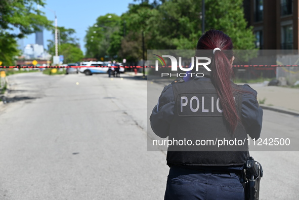 Chicago police are investigating the shooting scene. Two people are in critical condition after being shot in Chicago, Illinois, United Stat...