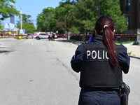 Chicago police are investigating the shooting scene. Two people are in critical condition after being shot in Chicago, Illinois, United Stat...