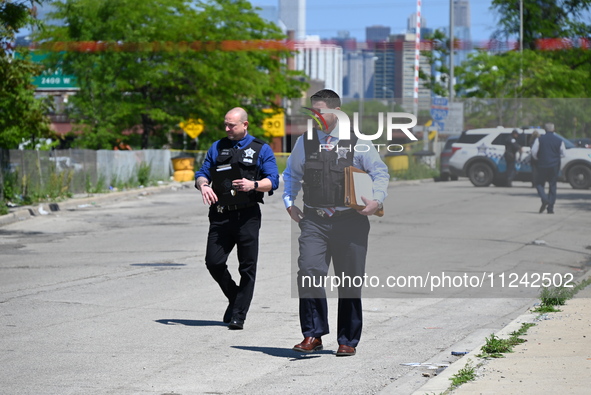 Chicago police are investigating the shooting scene. Two people are in critical condition after being shot in Chicago, Illinois, United Stat...