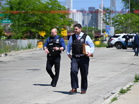 Chicago police are investigating the shooting scene. Two people are in critical condition after being shot in Chicago, Illinois, United Stat...