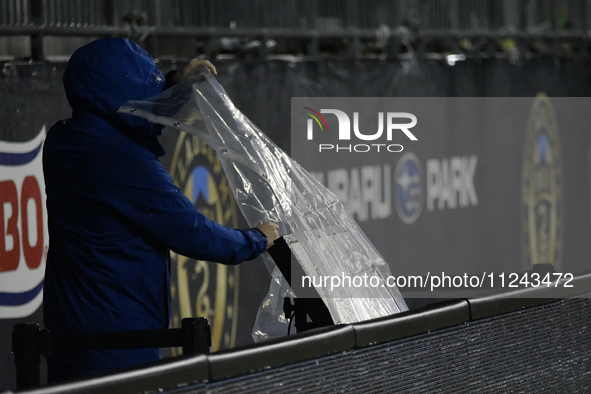 A video assistant referee (VAR) monitor on the sideline is being covered to protect it from inclement weather during the Philadelphia Union...