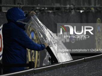 A video assistant referee (VAR) monitor on the sideline is being covered to protect it from inclement weather during the Philadelphia Union...