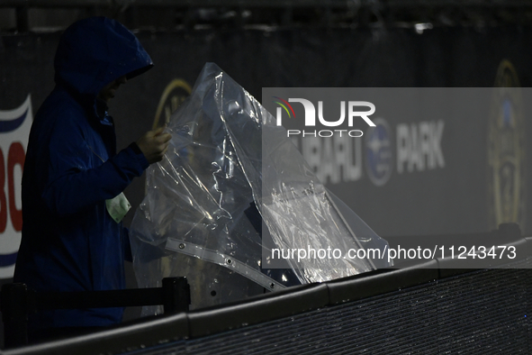 A video assistant referee (VAR) monitor on the sideline is being covered to protect it from inclement weather during the Philadelphia Union...