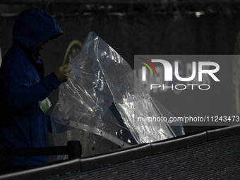 A video assistant referee (VAR) monitor on the sideline is being covered to protect it from inclement weather during the Philadelphia Union...