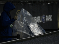 A video assistant referee (VAR) monitor on the sideline is being covered to protect it from inclement weather during the Philadelphia Union...