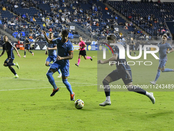 NYC FC's Defender Thiago Martins and Philadelphia Union's Forward Michael Uhre are in action during the second half of the Philadelphia Unio...