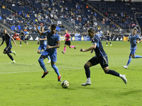 NYC FC's Defender Thiago Martins and Philadelphia Union's Forward Michael Uhre are in action during the second half of the Philadelphia Unio...