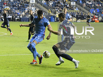 NYC FC's Defender Thiago Martins and Philadelphia Union's Forward Michael Uhre are in action during the second half of the Philadelphia Unio...