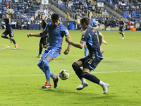 NYC FC's Defender Thiago Martins and Philadelphia Union's Forward Michael Uhre are in action during the second half of the Philadelphia Unio...