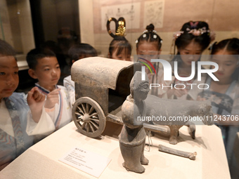 Primary school students are visiting Fengfeng Museum in Handan, China, on May 16, 2024. May 18 is International Museum Day. (